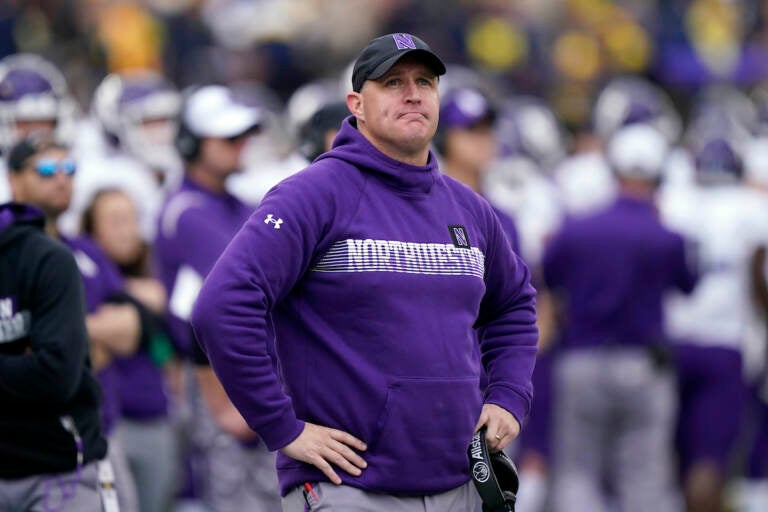 File photo: Northwestern head coach Pat Fitzgerald stands on the sideline during the first half of an NCAA college football game against Michigan, Oct. 23, 2021, in Ann Arbor, Mich.