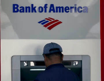 A customer uses an ATM at a Bank of America location in San Francisco, Monday, April 24, 2023