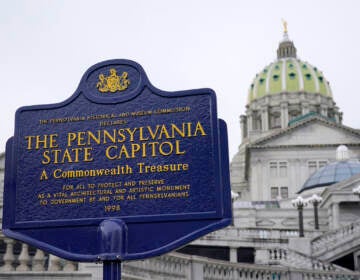 An historical marker at the Pennsylvania Capitol in Harrisburg, Pa., is seen on Feb. 21, 2023. A partisan dispute about funding for three of Pennsylvania’s state-related universities may mean higher tuition for in-state students as a budget impasse continues further into the summer. The state government approached two weeks without full spending authority on Tuesday, July 11, while loose ends remained untied. (AP Photo/Matt Rourke, File)