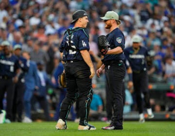 National League catcher Will Smith (16), of the Los Angeles Dodgers, greets Craig Kimbrel, of the Philadelphia Phillies, after defeating the American League 3-2 in the MLB All-Star baseball game in Seattle, Tuesday, July 11, 2023