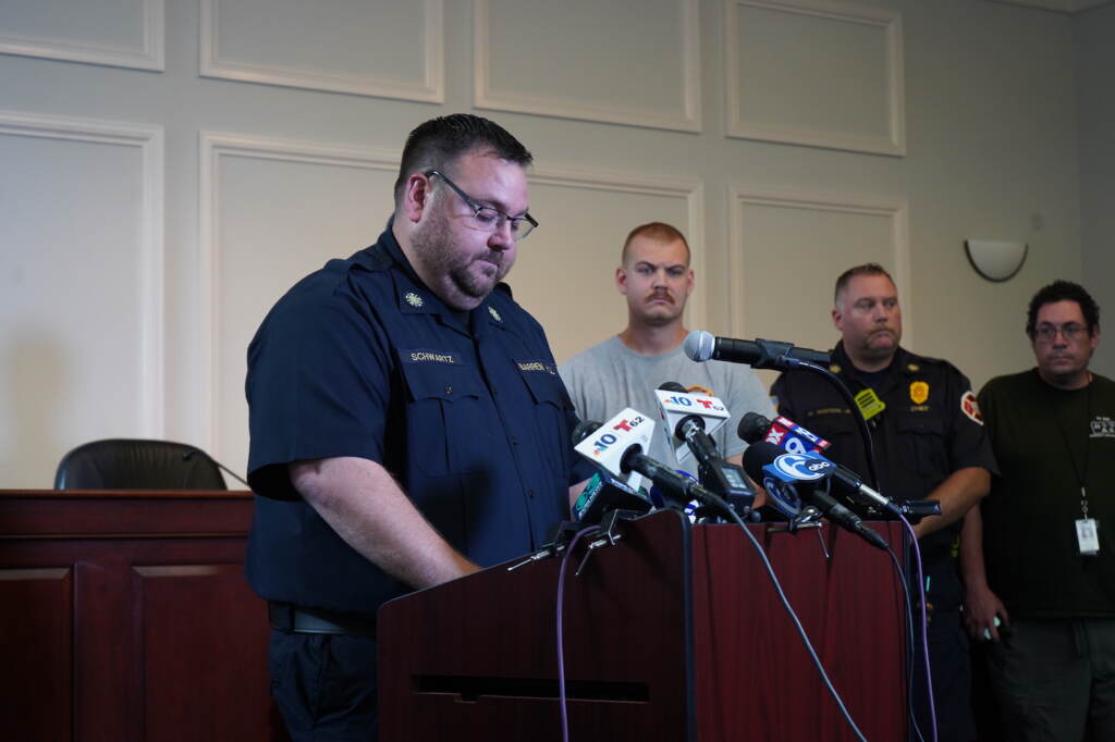 Chris Schwartz speaking at a podium