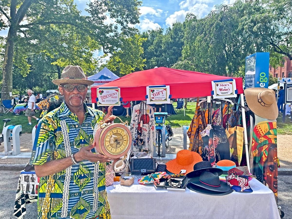 A vendor at the Lancaster Avenue Jazz and Arts Festival in Saunders Park displays his items.