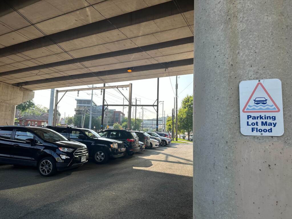 A signs warns that the parking lot for SEPTA commuters may flood