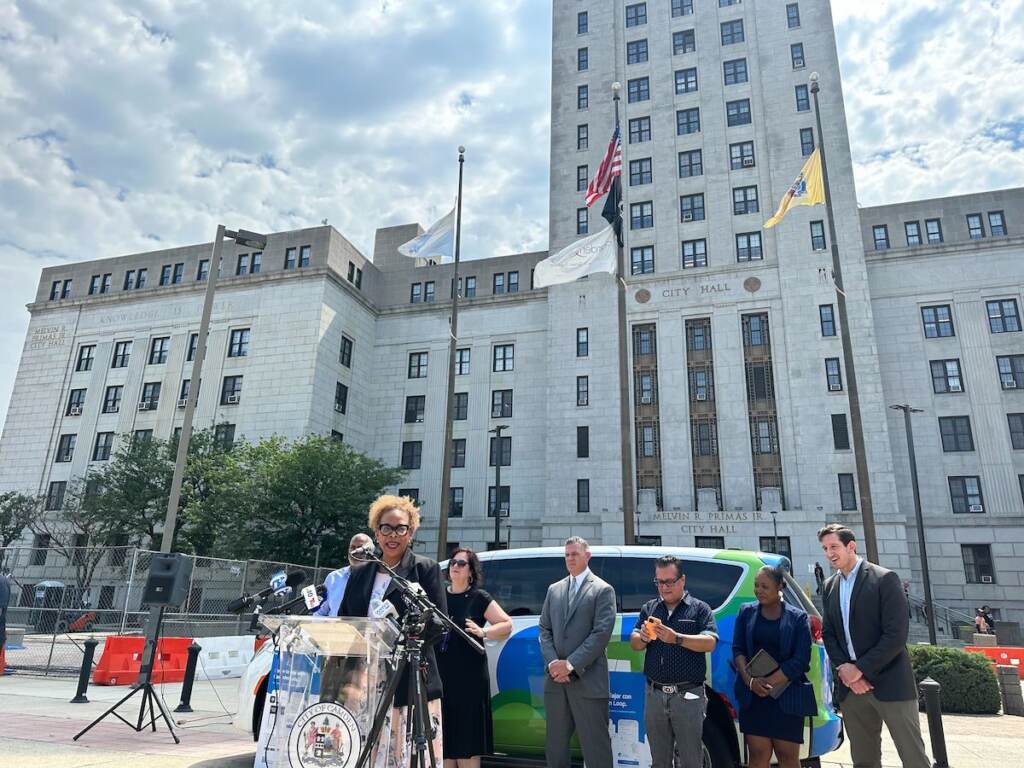 Dana Redd speaks at a podium outside of Camden City Hall.