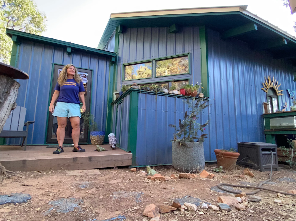 Beth Pratt stands outside her home near Yosemite National Park