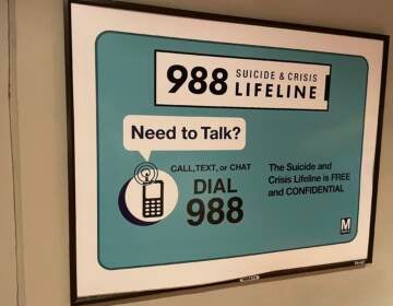 A sign advertises the 988 lifeline