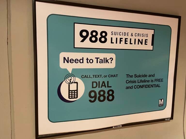 A sign advertises the 988 lifeline