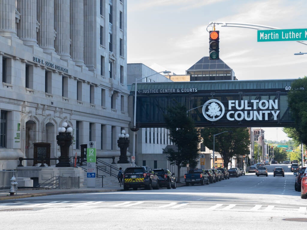 A view of a building and bridge that reads "Fulton County"