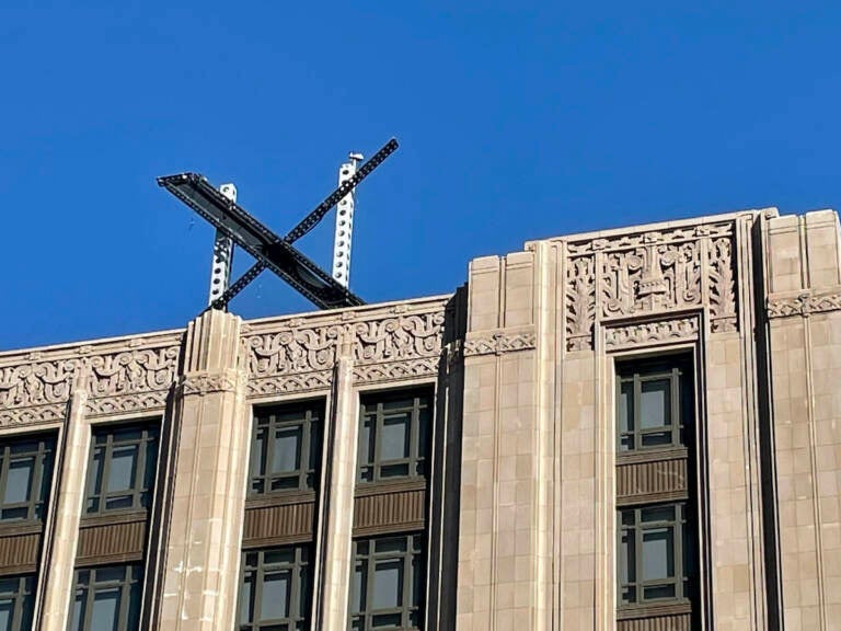 The new X sign is installed on the roof of the headquarters