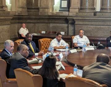 City Leaders sitting at a round table during a meeting.