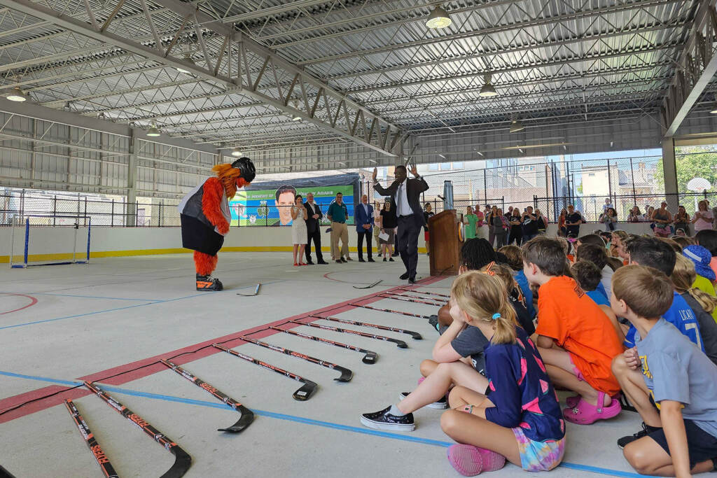 Philadelphia City Council President Darrell Clarke surrenders to Flyers mascot Gritty