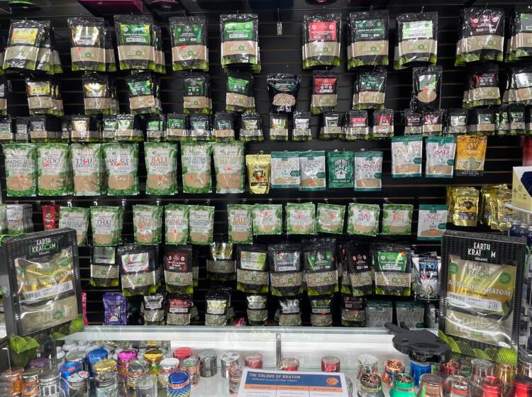 Shelves festooned with kratom powders, capsules, liquids and extracts
