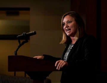 Pennsylvania Attorney General Michelle Henry speaks into a microphone at a podium.