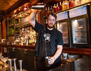 Post Haste co-owner and beverage creator Fred Bebee mixes a drink at the Post Haste bar.