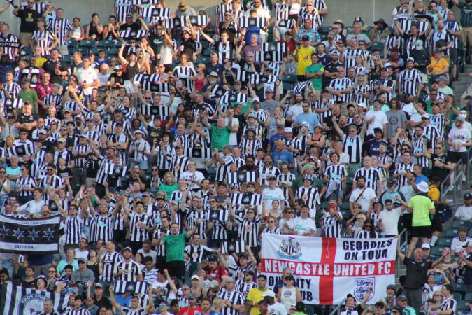 Fans watch Newcastle take on Aston Villa.