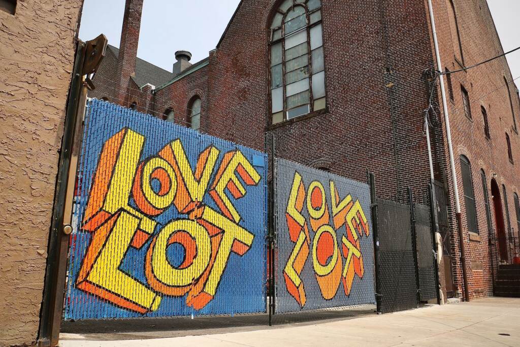 A sign says 'Love Lot' on the wall