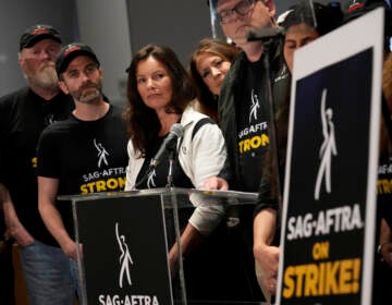 SAG-AFTRA president Fran Drescher, center, and SAG-AFTRA National Executive Director and Chief Negotiator Duncan Crabtree-Ireland, center right speak alongside SAG-AFTRA members during a press conference announcing a strike by The Screen Actors Guild-American Federation of Television and Radio Artists on Thursday, July, 13, 2023, in Los Angeles.