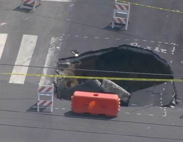 Large sinkhole in the middle of the intersection.