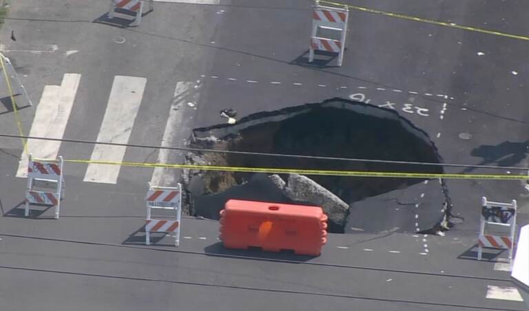 Large sinkhole in the middle of the intersection.