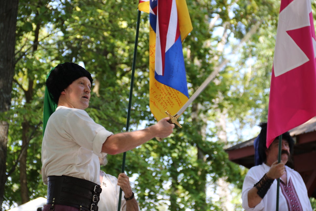 Oleksander Ersta displayed his swordsmanship for thousands of people at Sunday's Ukrainian Folk Festival. (Cory Sharber/WHYY)