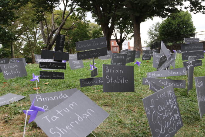 Signs featuring names of people who have died from drug overdoses were placed at McPherson Square on Tuesday