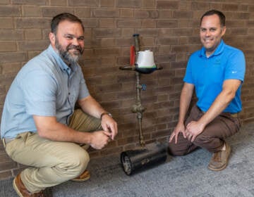 Tim Filasky, director of Public Works & Water Resources in Newark, Del. (left) with Del. Water Operations Superintendent Mark Neimeister with a lead pipe testing example