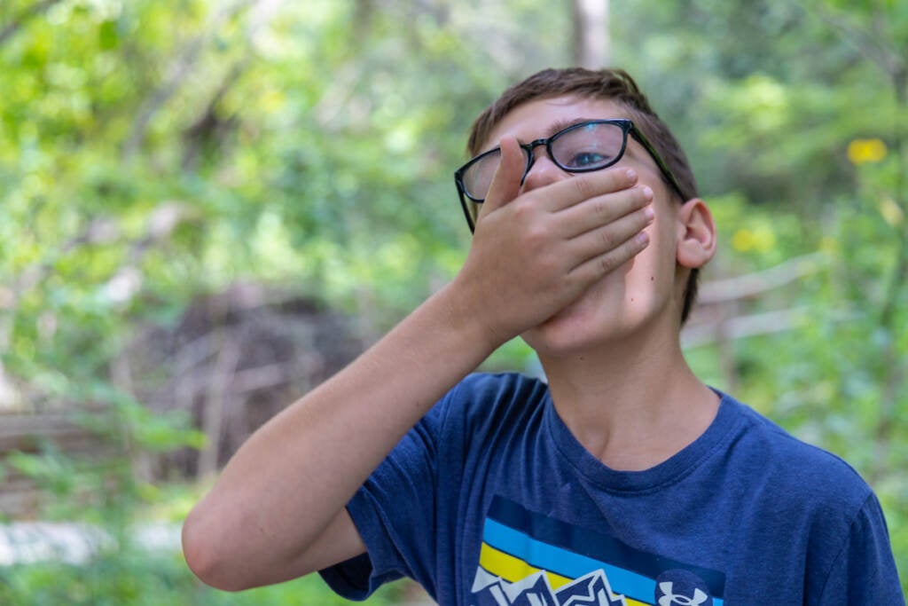 Gavin Drabik, 10, eats a pizza worm.