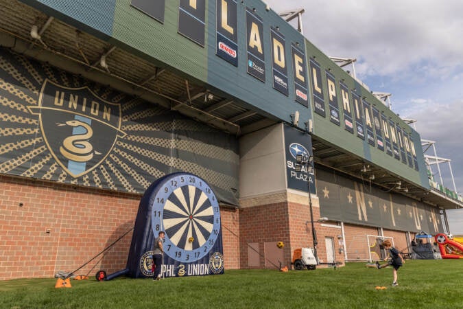 Coen Hecht, 8, a South Jersey Atlantic Untied left wing, plays a soccer target game outside Subaru Park stadium in Chester, Pa. before the Philadelphia Union’s semi-final match against Inter Miami on August 15, 2023. (Kimberly Paynter/WHYY)