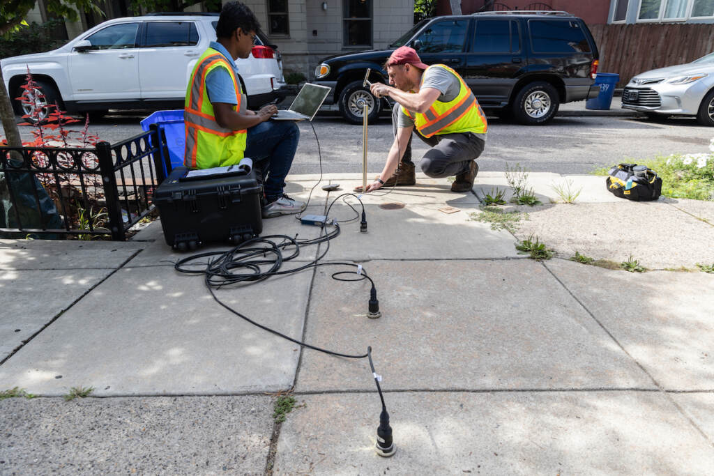 K I M Iqbal, a 2nd-year PHD student at Drexel University’s CAEE program (Civil, Architectural & Environmental Engineering) (left) and John DeVitis, a CAEE senior research scientist (right) use sensors to record waves created by striking pipes