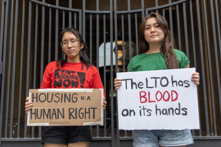 File photo: Janna Goliff, communications team co-lead (left) and Hanae Togami, member (right) with the Renter’s Justice Campaign protested the Landlord Tenant Office outside the municipal court building in Philadelphia on August 21, 2023. (Kimberly Paynter/WHYY)