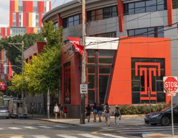 A building with Temple's logo is visible