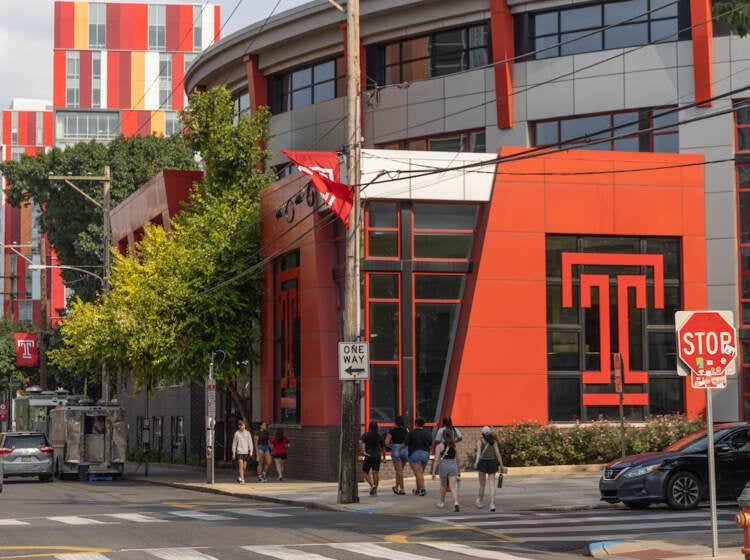 A building with Temple's logo is visible