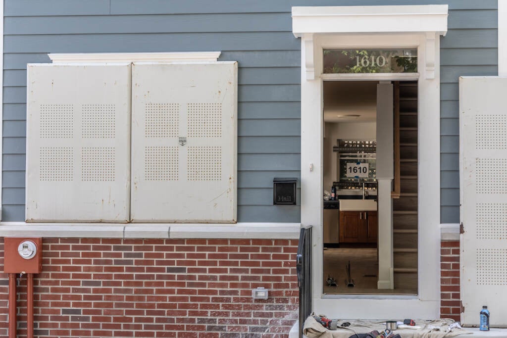 The doorway of a new rowhome is visible