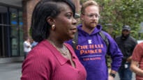 Cherelle Parker speaking to a group of reporters outside
