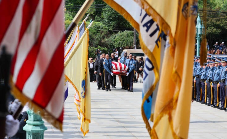 A New Jersey State Police honor guard carry the casket containing the remains of former N.J. Lt. Gov. Sheila Oliver