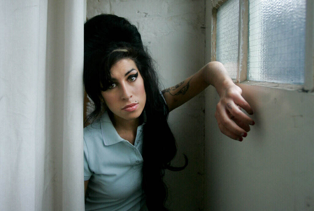 Amy Winehouse poses for a photo