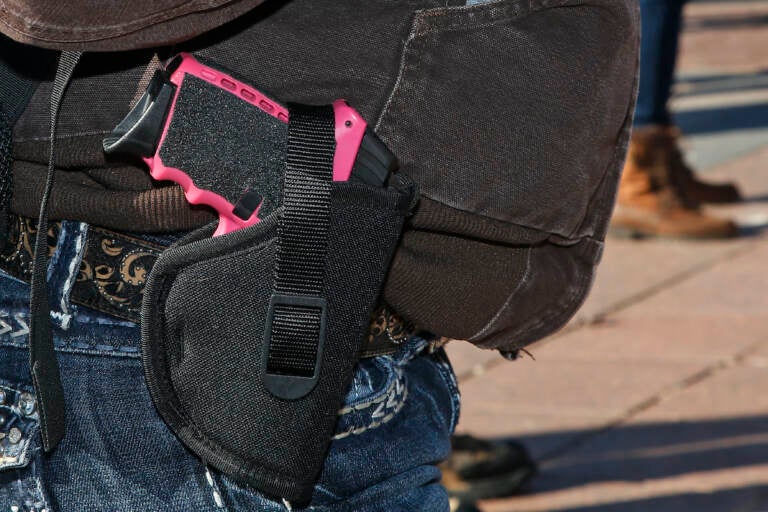 Gun advocates attend a rally at the state Capitol to mark the start of a new law that allows most adults in Oklahoma to carry a firearm in public without a background check or training, Friday, Nov. 1, 2019, in Oklahoma City