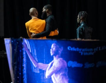 Otis Pena (left) a friend of O'Shae Sibley, walks off stage after speaking during a celebration of life for Sibley on Tuesday, Aug. 8, 2023, at The Met Philadelphia, in Philadelphia