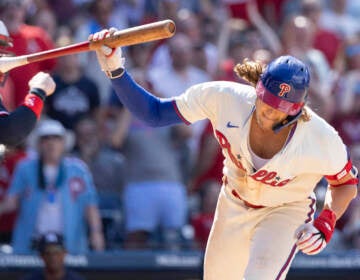 Philadelphia Phillies' Alec Bohm throws his bat after striking out with the bases loaded during the seventh inning of a baseball game against the Minnesota Twins, Sunday, Aug. 13, 2023, in Philadelphia. (AP Photo/Laurence Kesterson)