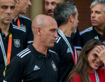 President of Spain's soccer federation, Luis Rubiales (center) stands with Spain's Women's World Cup soccer team after their World Cup victory at La Moncloa Palace in Madrid, Spain, Tuesday, Aug. 22, 2023