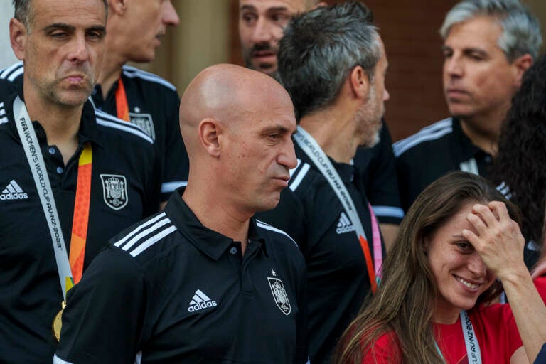 President of Spain's soccer federation, Luis Rubiales (center) stands with Spain's Women's World Cup soccer team after their World Cup victory at La Moncloa Palace in Madrid, Spain, Tuesday, Aug. 22, 2023