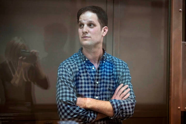 File photo: Wall Street Journal reporter Evan Gershkovich stands in a glass cage in a courtroom at the Moscow City Court, in Moscow, Russia, April 18, 2023. Gershkovich, who was detained on espionage charges, arrived at a Moscow court Thursday, Aug. 24, for a hearing on a motion by the prosecution to extend his arrest.  (AP Photo/Alexander Zemlianichenko, File)