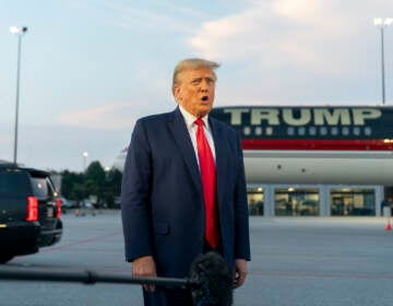 File photo: Former President Donald Trump speaks with reporters before departure from Hartsfield-Jackson Atlanta International Airport, Thursday, Aug. 24, 2023, in Atlanta.