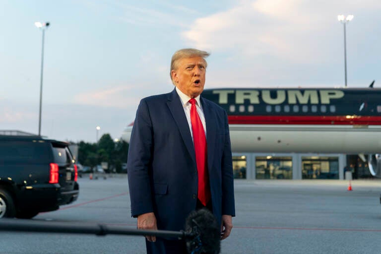 File photo: Former President Donald Trump speaks with reporters before departure from Hartsfield-Jackson Atlanta International Airport, Thursday, Aug. 24, 2023, in Atlanta.