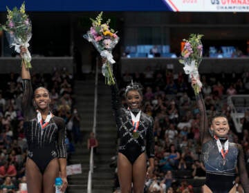 Shilese Jones (from left), Simone Biles and Leanne Wong pose for a photograph after placing second, first and third place, respectively, in all-around competition at the U.S. Gymnastics Championships, Sunday, Aug. 27, 2023, in San Jose, Calif.