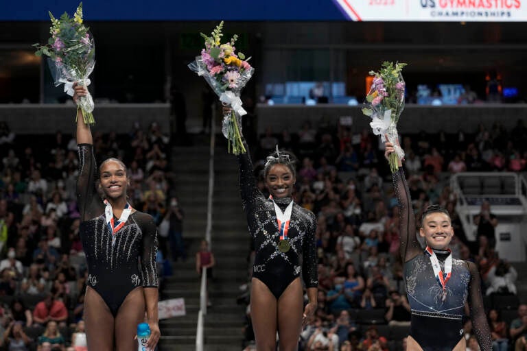 Shilese Jones (from left), Simone Biles and Leanne Wong pose for a photograph after placing second, first and third place, respectively, in all-around competition at the U.S. Gymnastics Championships, Sunday, Aug. 27, 2023, in San Jose, Calif.