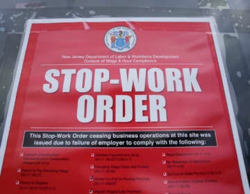 Stop work order sign hanging on a door