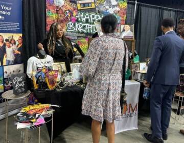 A Brewerytown business development group Mom Your Business listened to attendees at the National Black Business Expo in Philadelphia. (Kristen Mosbrucker-Garza/WHYY)