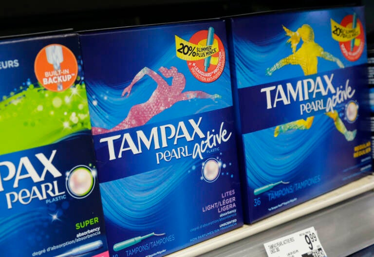 Boxes of tampons on a shelf in a store