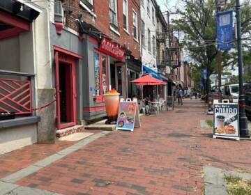 Shop windows on a busy commercial corridor.